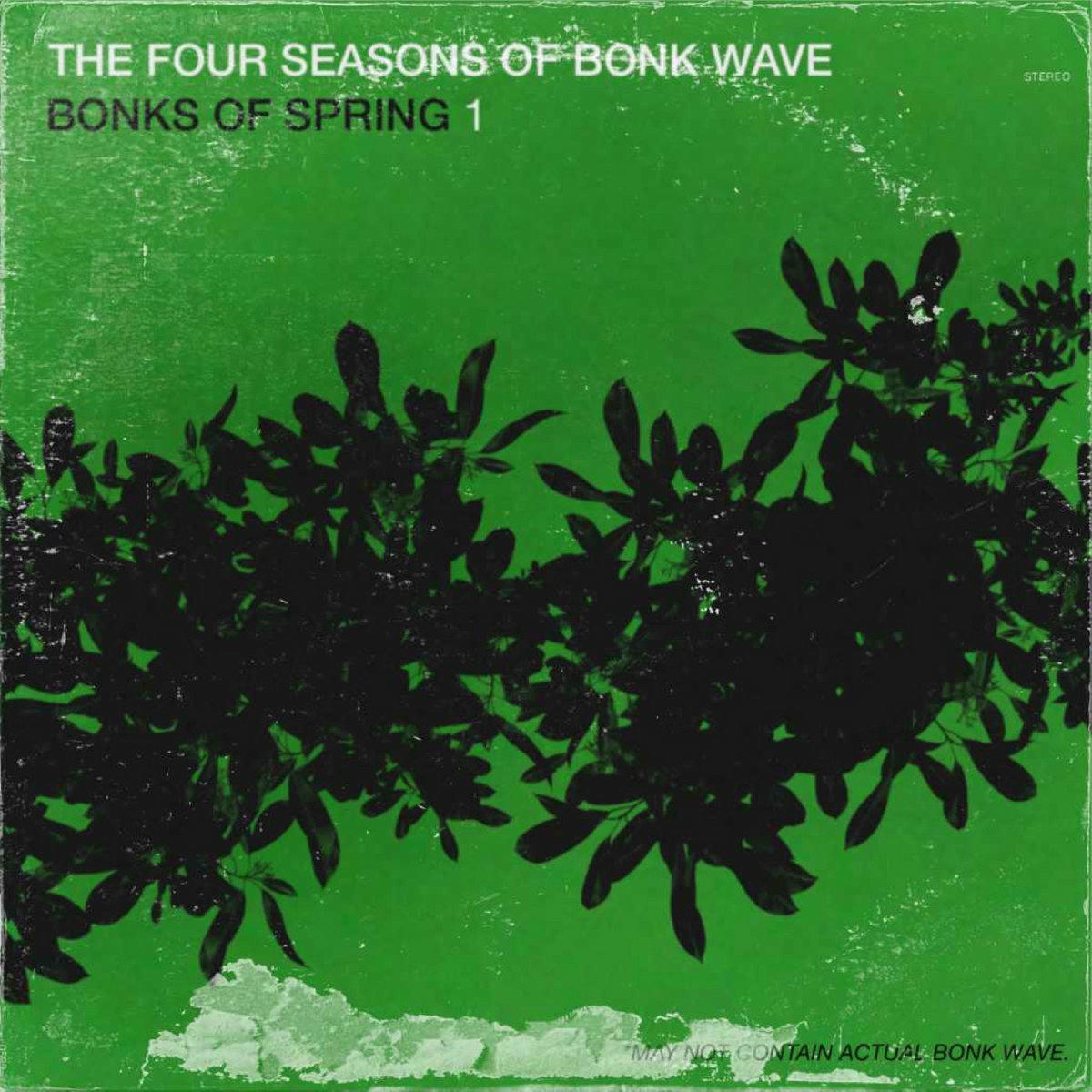 A dark branch of leaves against a green background on an LP cover with wear and tear.