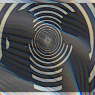 Two figures face each other, Electric Company style, with a black and white swirling bullseye.